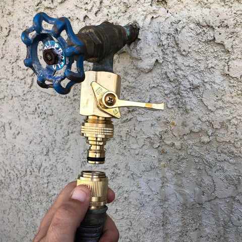 Solid Brass Garden Hose Quick Connect Set With 3/4 Inch GHT attached to outdoor water faucet