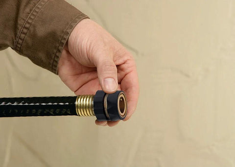 Hand connecting Heavy Duty Brass Hose Quick Connect Set With Male Adapter And Female Connector For Quick No Twist Attachments Weatherproof Garden Hose Fittings Save Time Switching Hose End Accessories In The Yard.