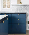 Leaf Shaped Cabinet Handles Set, Solid Brass With Brushed Gold Finish installed on blue kitchen cabinets