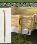 14 x 4 Inch Reamer Tek Torx Star Head Self Drilling Screws With T30 Head Brass Pack Of 25 shown next to a wooden trailer flatbed.