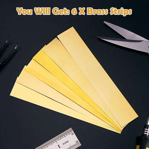 Brass Shim Stock Assortment 1 Inch By 6 Inch 6 Pieces With Thicknesses 0.002 0.004 0.006 0.008 0.012 0.016 Inches on dark surface with tools