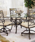 Dining room set with glass table and four metal chairs on brass vintage antique 2 inch ball caster wheels