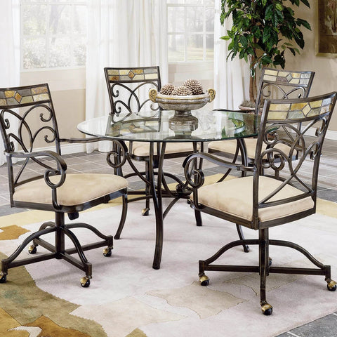 Dining room set with glass table and four metal chairs on brass vintage antique 2 inch ball caster wheels