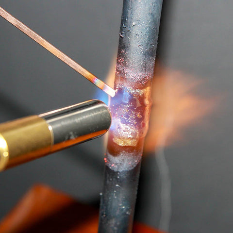 Workhorse Bare Bronze Brazing Rods Pack Low Fume Copper Alloy For Torch Welding shown in use on metal pipe joining