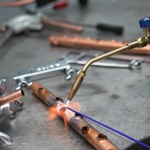 Brazing with AWS BAg7 Silver Brazing Rods Flux Coated Solder Kit Pro Grade, showing welding process on metal pipes.