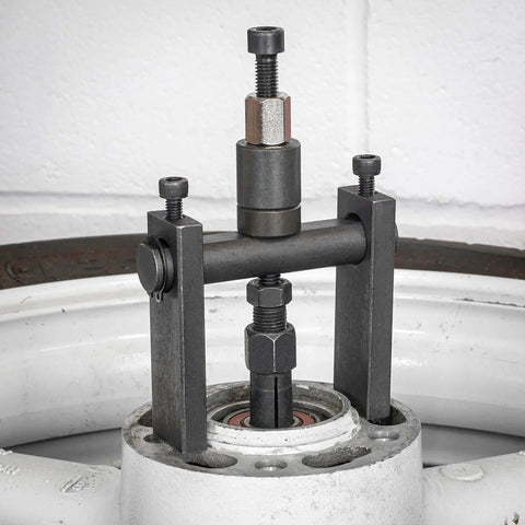 10pc Bridge Bearing Puller Set installed on machinery, demonstrating bearing removal process with screw-type extractor and collet grips