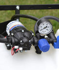 Universal Broadcast Sprayer Pressure Regulator With Quick Connect Bypass Port, showing gauge and connectors for spray control