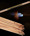 Workhorse Bare Bronze Brazing Rods Pack Low Fume Copper Alloy for Torch Welding shown with torch flame