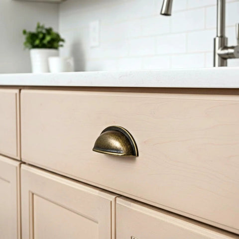 Brass Bronze Cup Drawer Pull on kitchen cabinet, features 3-inch center to center spacing, part of Twelve Pack Cabinet Cup Pulls Set for furniture.
