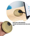 Bronze Desk Grommets 4 Pack 2 Inch Diameter Cable Hole Covers With Hole Saw installed on office desk for cable management.