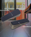 Antique Bronze Heavy Duty Door Wedge With Anti Slip Rubber Base Keeps Bottom Of Door Open And Prevents Slams Includes Silencer Pads To Protect Walls 2 Pack Door Stopper For Floor Protection And Quiet Stays Put shown on floor.