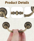 Close-up of Two Bronze Vintage Drop Bail Drawer Pulls With 3.5 Inch Center Spacing And 4.5 Inch Total Length in hand view
