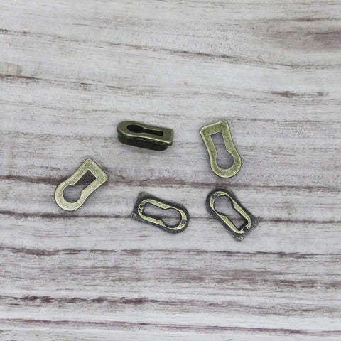 5 Pack Zinc Alloy Keyhole Covers in Bronze Tone for Dresser Furniture Lock Decoration Cabinets and Desks, 18x8mm size, top view.