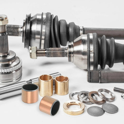 Five Pack Sleeve Bearings With Three Quarters Inch Bore And Seven Eighths Inch Outer Diameter One Inch Length Self Lubricating Oilless Bushings shown with automotive parts