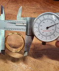 Torque Converter Bushing Kit For Mini Bike And Go Kart, bronze idler bushing being measured with caliper, detailed view
