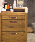 Wooden dresser with 4 Pack Leather Cabinet Handles With Screws, soft brown leather pulls, fitted in a kitchen setting.
