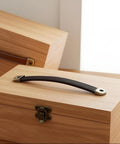 4 Piece Leather Cabinet Pulls And Luggage Handles Replacement Brown Leather Drawer Pulls with screws installed on wooden box