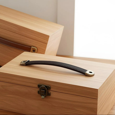 4 Piece Leather Cabinet Pulls And Luggage Handles Replacement Brown Leather Drawer Pulls with screws installed on wooden box