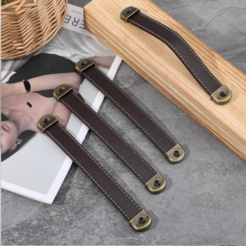 4 Piece Leather Cabinet Pulls And Luggage Handles Replacement Brown Leather Drawer Pulls for cabinets on wooden surface with screws