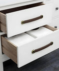 Brown leather cabinet pulls installed on white drawers, part of 4 Piece Leather Cabinet Pulls And Luggage Handles Replacement with screws.