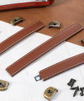 Three Piece Brown Leather Drawer Pulls Set With Mounting Screws For Cabinets Trunks And Suitcases, includes screws and hardware components.