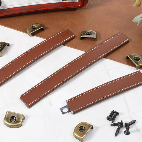 Three Piece Brown Leather Drawer Pulls Set With Mounting Screws For Cabinets Trunks And Suitcases, includes screws and hardware components.
