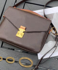 Handbag on table with 2 Pack 1 Inch Spring O Rings For Purses And Handbags, Gold Finish, Easy Spring Opening Clips, rust resistant zinc alloy