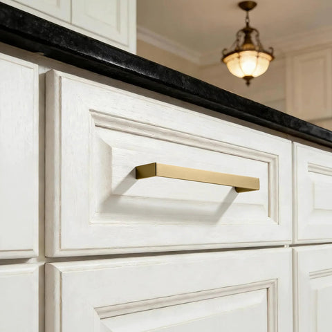 Brushed Brass Cabinet Pulls Set Of 10, 3-Inch Hole Center Handles in gold on white kitchen cabinets, solid square design