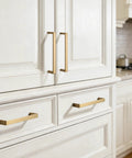 Brushed Brass Cabinet Pulls Set Of 10, 3-Inch Hole Center Handles for kitchen cabinets and drawers installed on white cabinets