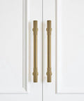 2 Pack 6 Inch Hole Center Brushed Brass Cabinet Pulls For Drawers Dressers And Cabinets installed on white cabinet doors