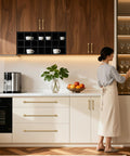 Woman using 10 Pack 15 Inch Hole Center Brushed Champagne Bronze Modern Cabinet Pulls in a contemporary kitchen setting.
