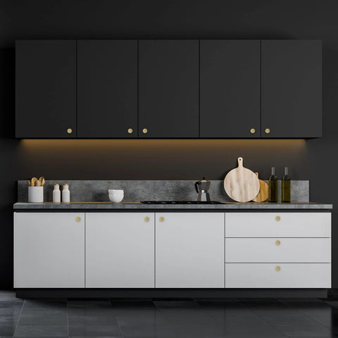 Modern kitchen with black and white cabinets featuring Solid Brass Brushed Gold Cabinet Knobs Set on doors and drawers.