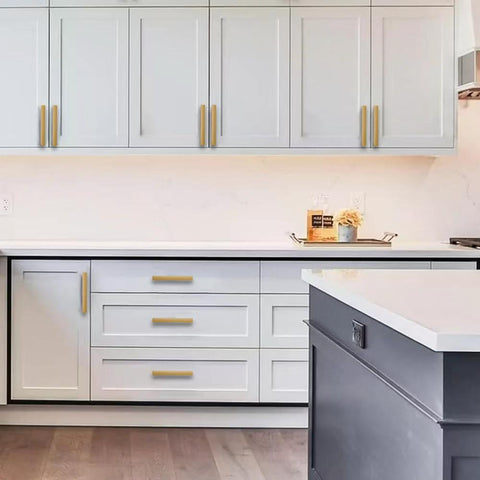 Brushed Gold Cabinet Pulls 4 Inch 2 Pack Solid Zinc Alloy Drawer Handles installed on white kitchen cabinets and drawers