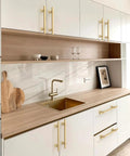 Modern kitchen with 10 Pack Brushed Gold Cabinet Pulls 5 Inch 128mm Kitchen Cabinet Handles for doors and drawers, wood countertop.
