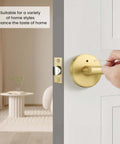 Hand turning Brushed Gold Privacy Door Levers Set for Bedroom and Bathroom, showing modern interior door hardware, keyless reversible function
