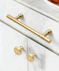 Brushed Gold Kitchen Cabinet Knobs 10 Pack Zinc Alloy Single Hole Round Drawer Pulls For Cabinets And Dressers installed on a white cabinet
