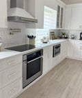 Modern kitchen with Brushed Nickel Cabinet Pulls 5 Inch Long, 10 Pack Stainless Steel Kitchen Hardware installed on white cabinets.