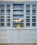 5 Pack 6 Inch Hole Center Brushed Satin Nickel Cabinet Pulls With Backplate installed on blue kitchen drawers