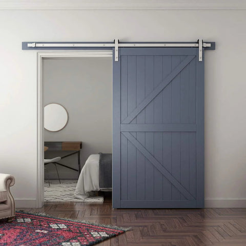 Eight Feet Brushed Nickel Sliding Barn Door Hardware Kit With I Shape Hanger For A 48 Inch Wide Door Panel installed in a bedroom