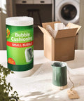 Bubble Wrap Protective Packaging 12 Inch Wide 30 Foot Roll for delicate items next to a carton box on a kitchen countertop.