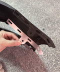 Hand holding Beefed Up Front Bumper Repair Metal Plate For Ford Fusion 2013 To 2016 next to bumper clip area