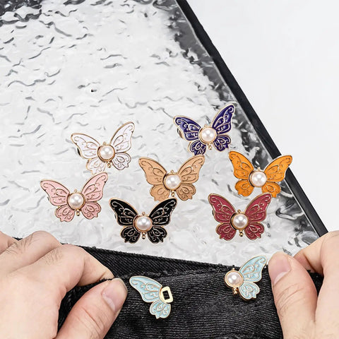 8 Piece Butterfly Jeans Button Waist Tighteners Set With Detachable Clips Adjustable Waist Buckles displayed on fabric
