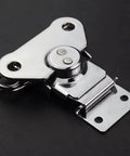 Small butterfly twist latch with keeper plate in zinc plated steel delivers smooth twist action and durable security