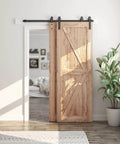 Installed 5 Feet Bypass Sliding Barn Door Hardware Kit for Double Wooden Doors with Single Track in a living room setting.