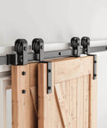 5.5 Feet Bypass Sliding Barn Door Hardware Kit for Double Wooden Doors with Single Track installed on wooden doors.