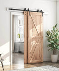 5.5 Feet Bypass Sliding Barn Door Hardware Kit installed on wooden doors in modern room, showing heavy duty carbon steel rail and single track