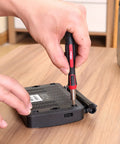 Person using 77 Piece Precision Tool Kit With Magnetic Screwdriver And Case For Electronics, Cell Phone And PC Repairs, CR-V Steel Bits