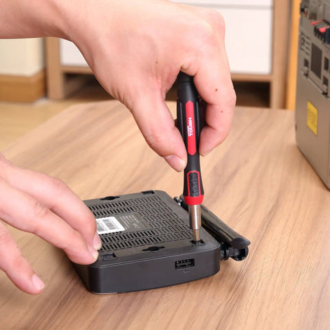 Person using 77 Piece Precision Tool Kit With Magnetic Screwdriver And Case For Electronics, Cell Phone And PC Repairs, CR-V Steel Bits