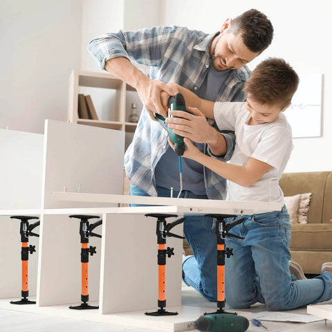 Father and son using Adjustable Support Pole - Cabinet Jack, Drywall Lift, 16.2-31.9Inch, for cabinet assembly in living room.