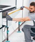Man using Third Hand Support Pole Heavy Duty, Cabinet Jacks for Installing Cabinets with 285 LBS Capacity in a kitchen setting